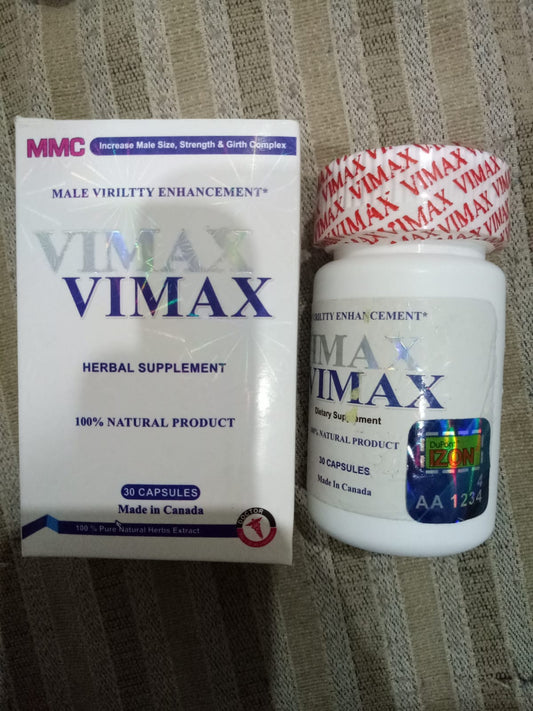 Vimax herbal supplement packaging and bottle on a textured surface